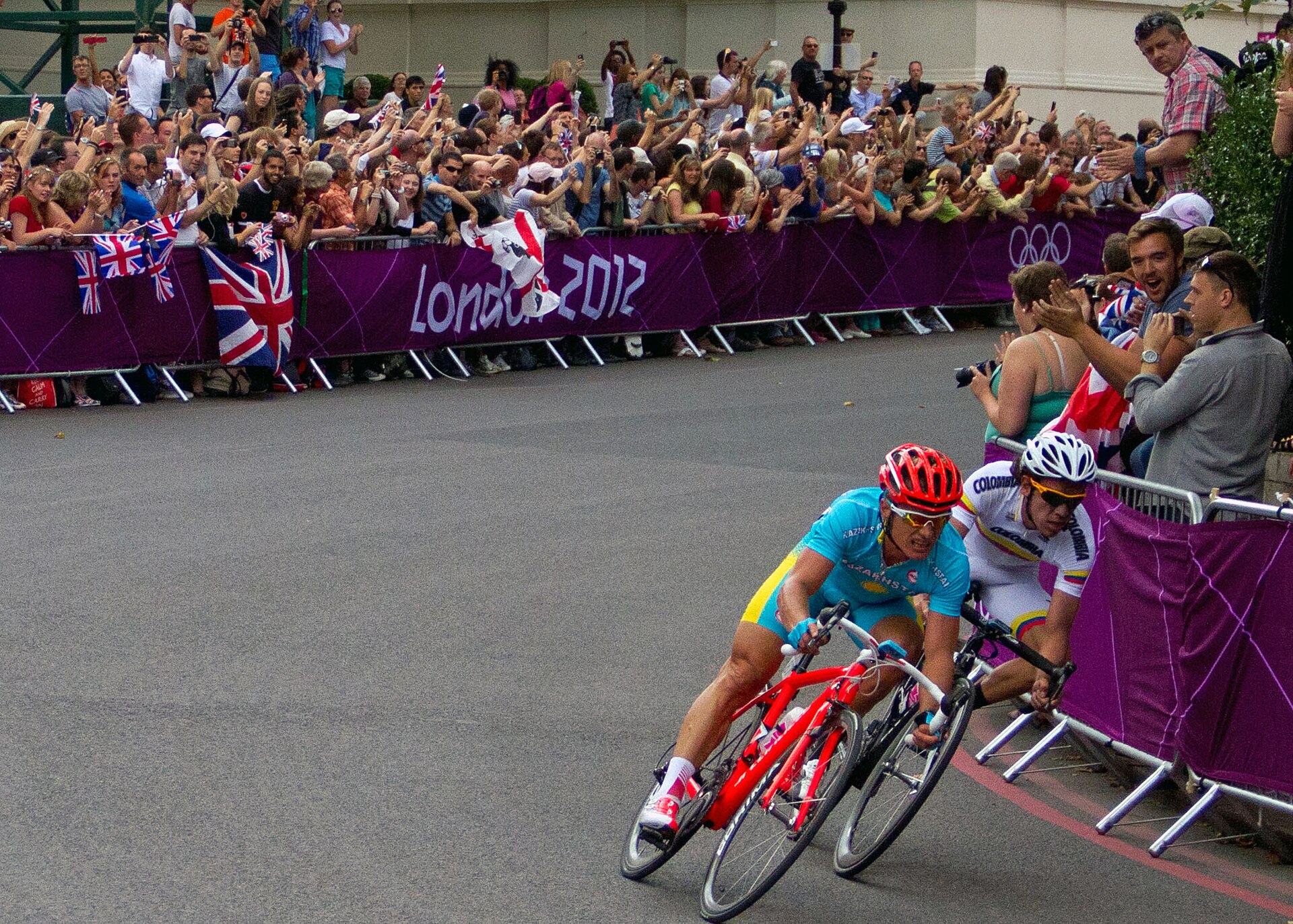 Real cyclists racing together in a road cycling event