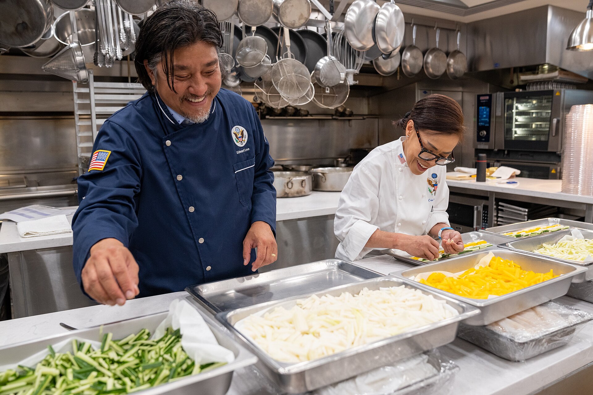 Real chefs preparing food in a professional kitchen