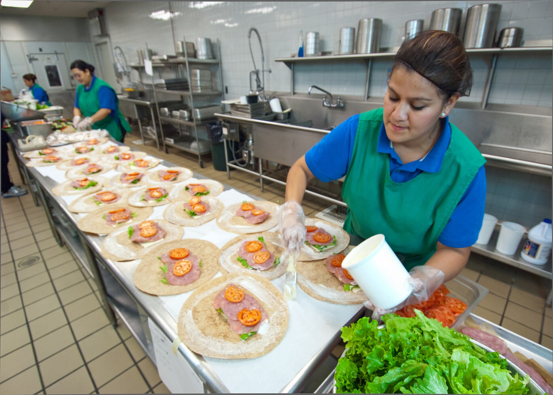 Real people preparing ingredients in a kitchen